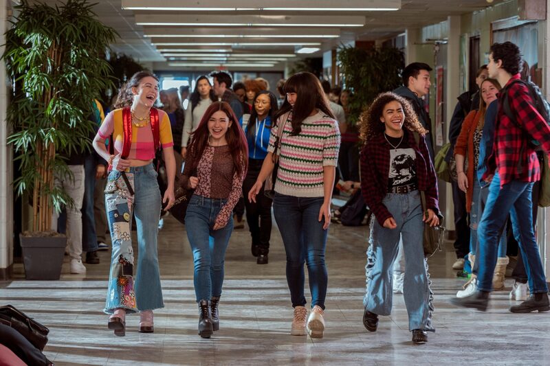 max abby nora and ginny walking in school hallway