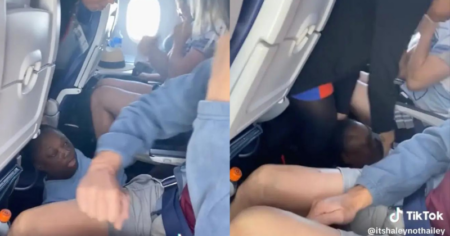 Woman kicked off plane after spitting on other passengers