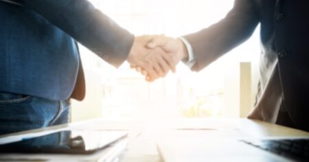 Two Businessmen Shake Hands