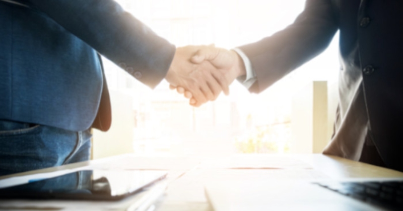 Two Businessmen Shake Hands